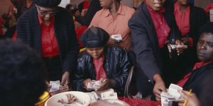 Women belonging to a savings club - Stokvel / Round / Mukando counting handing each other and counting money.